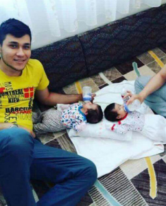 New police recruit Nazif Emre Horoz with his twins.